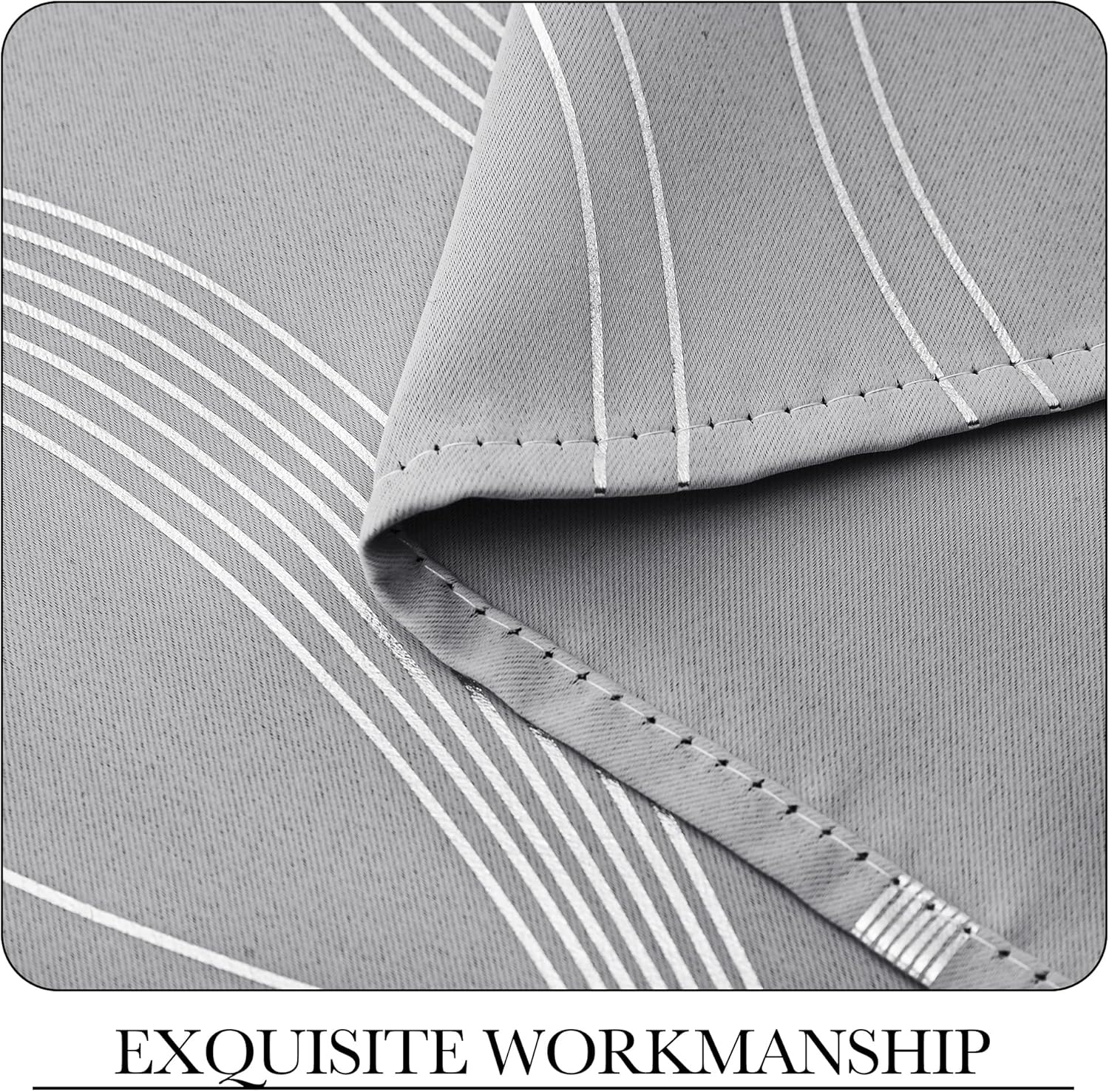 Close-up of light grey woven fabric with reflective silver vertical stripes and a neatly stitched hem.