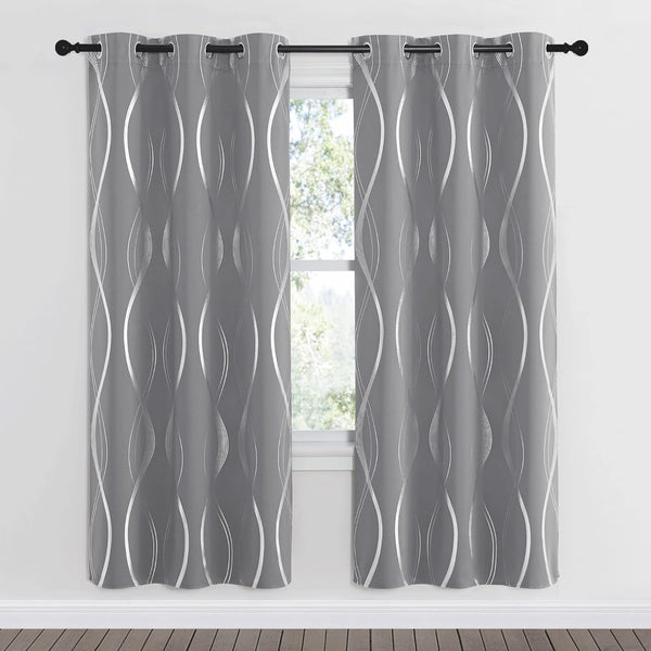 Pair of grey curtains with metallic silver wavy pattern and grommet tops.