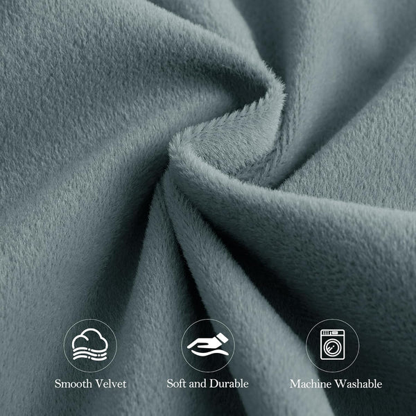 Close-up of smooth, soft, and durable grey velvet fabric, highlighted as machine washable.