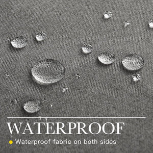 Close-up of dark grey textured fabric with water droplets beading on the surface, showcasing its waterproof quality.