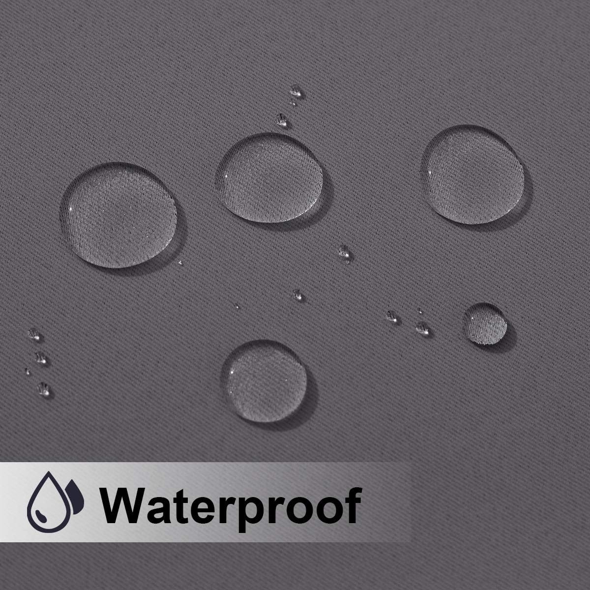 Close-up of textured dark grey fabric with water droplets beading, showcasing its waterproof quality.