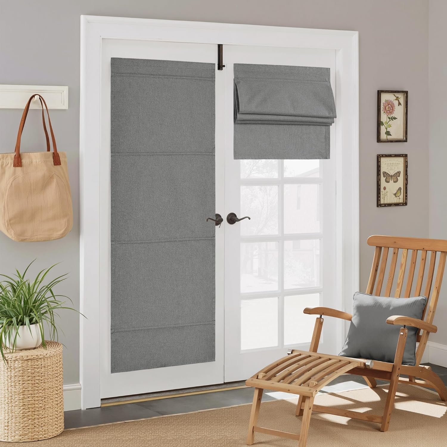 Heather gray fabric flat roman shades on white french doors; one fully extended, one partially raised.