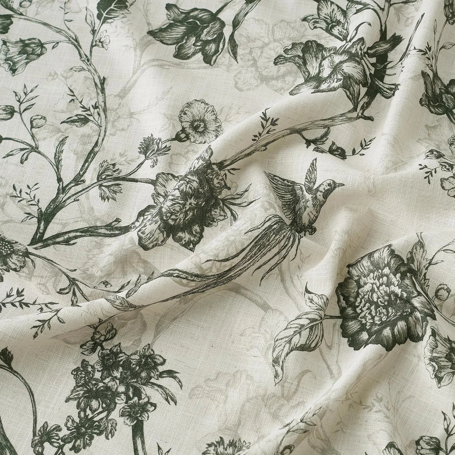 Ivory fabric with black botanical floral and bird toile-style print in soft folds