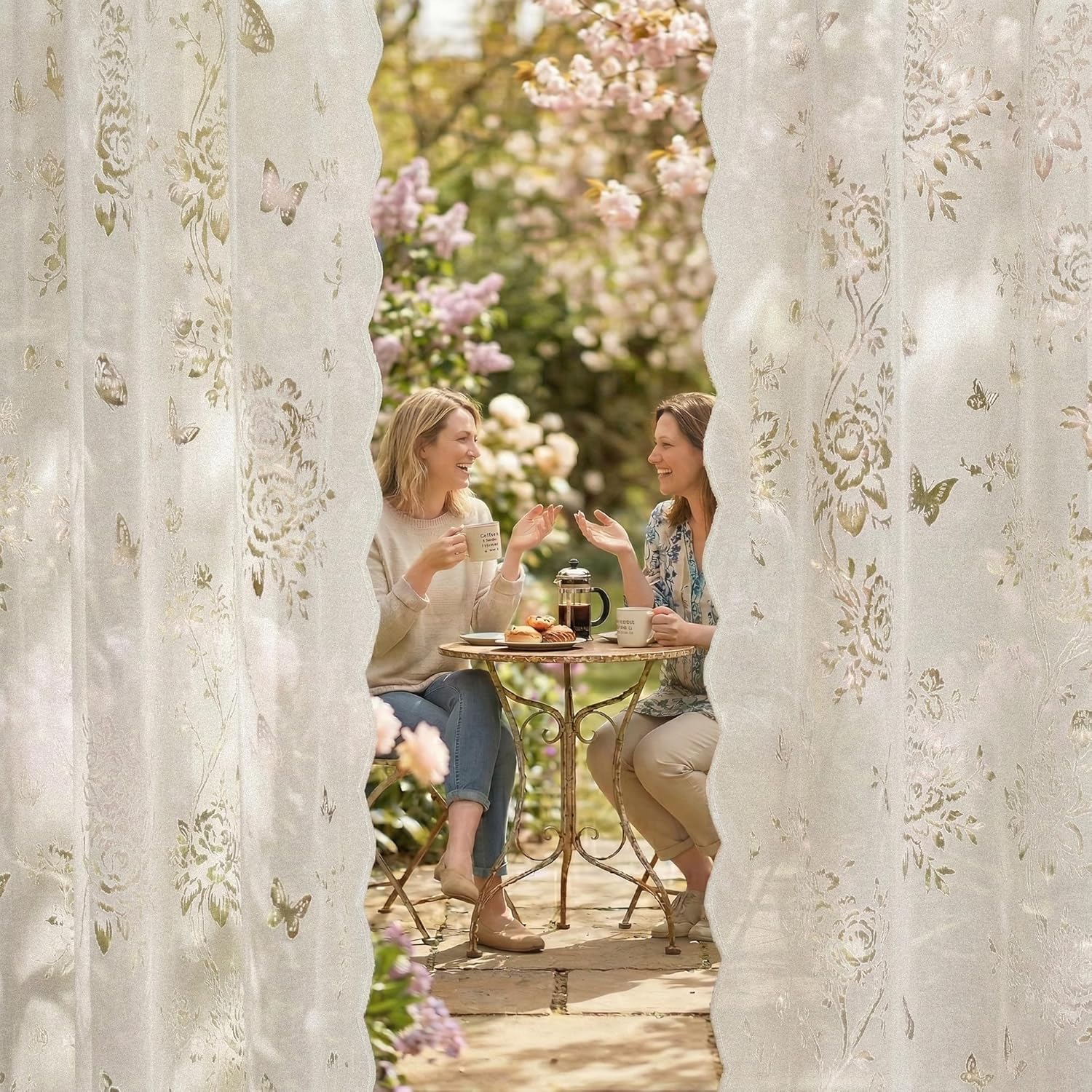 Ivory sheer curtains with gold floral and butterfly patterns, and decorative scalloped edges.
