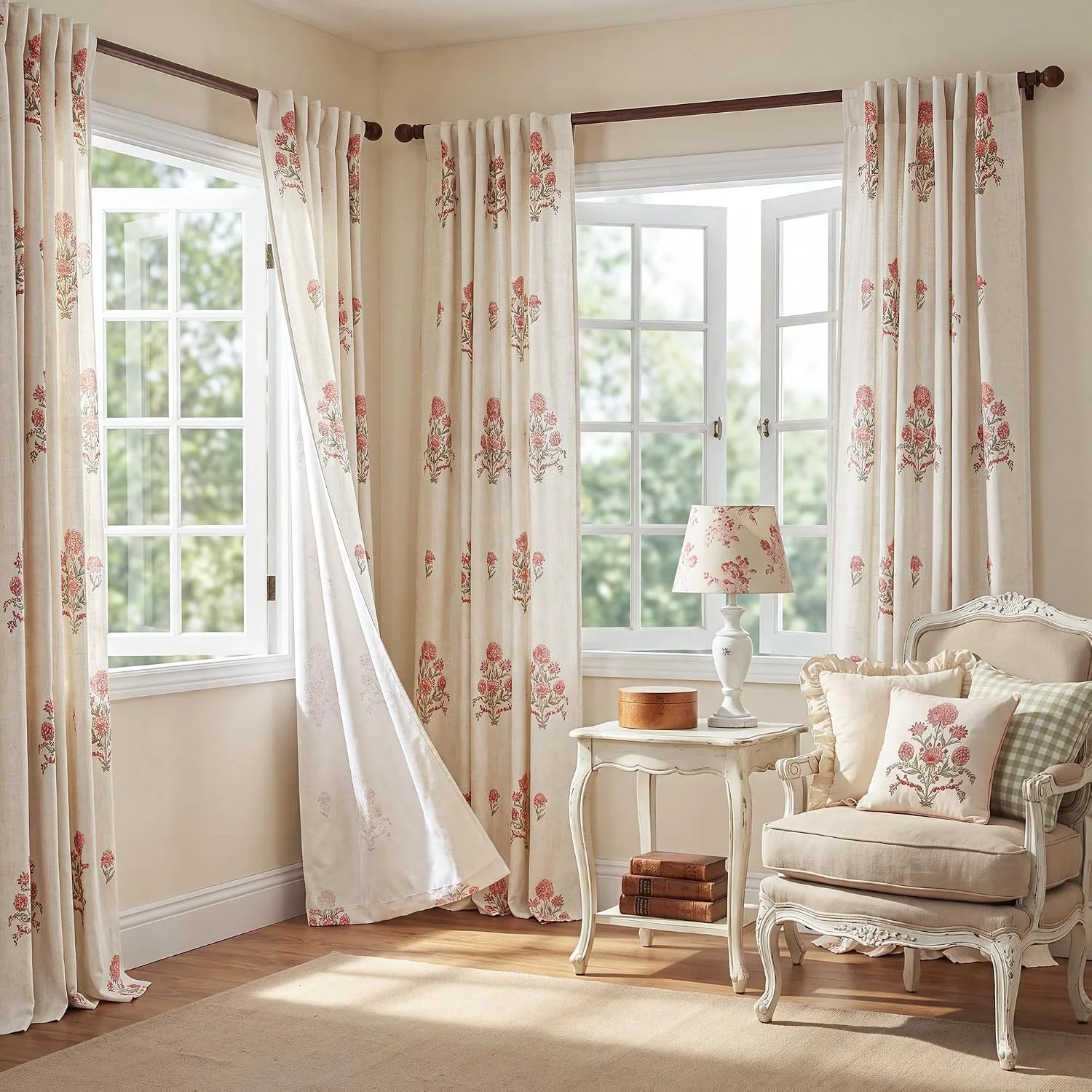 Ivory floral linen curtains on wooden rods in a bright vintage style sitting room