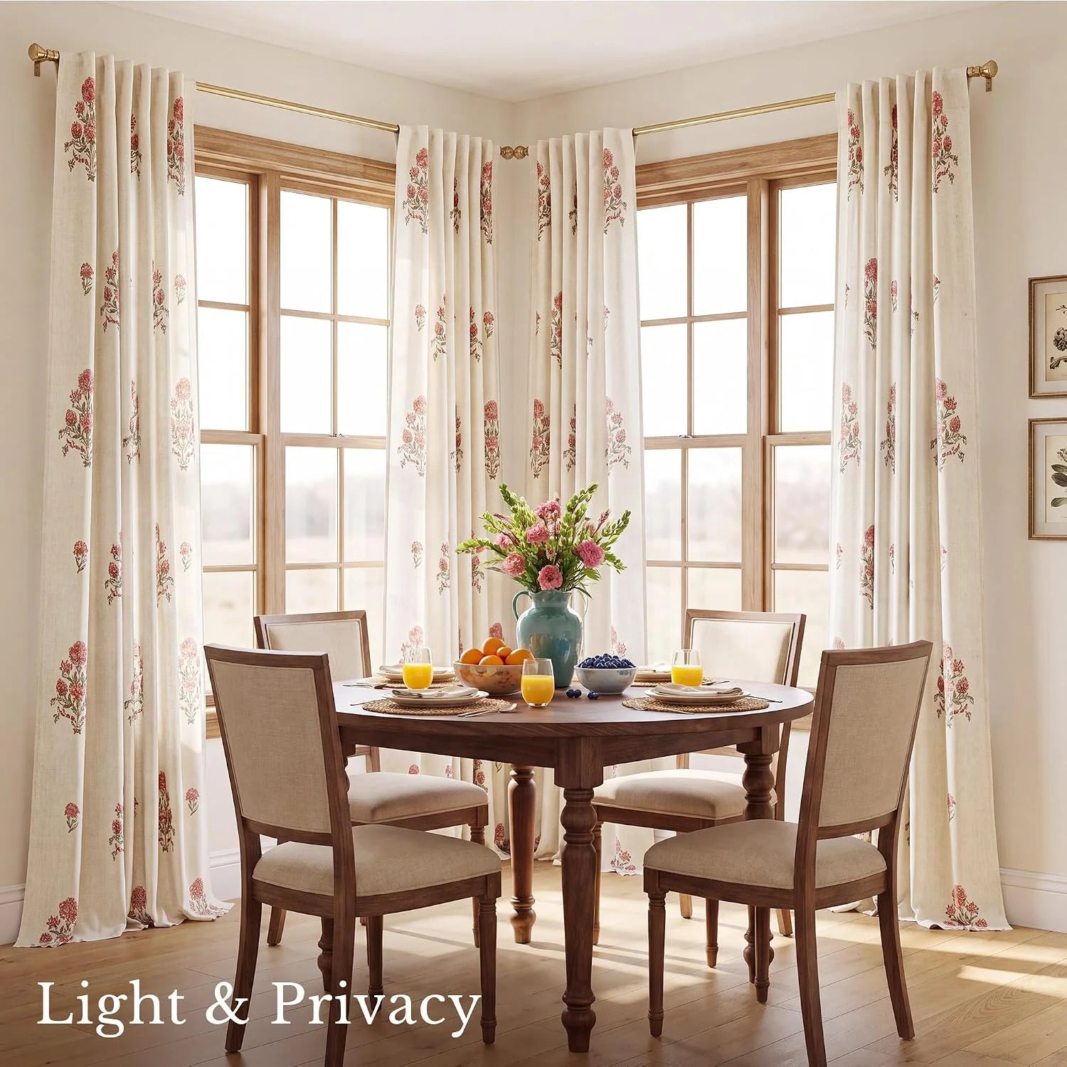 Ivory floral curtains with soft pink blooms in a bright wooden dining room