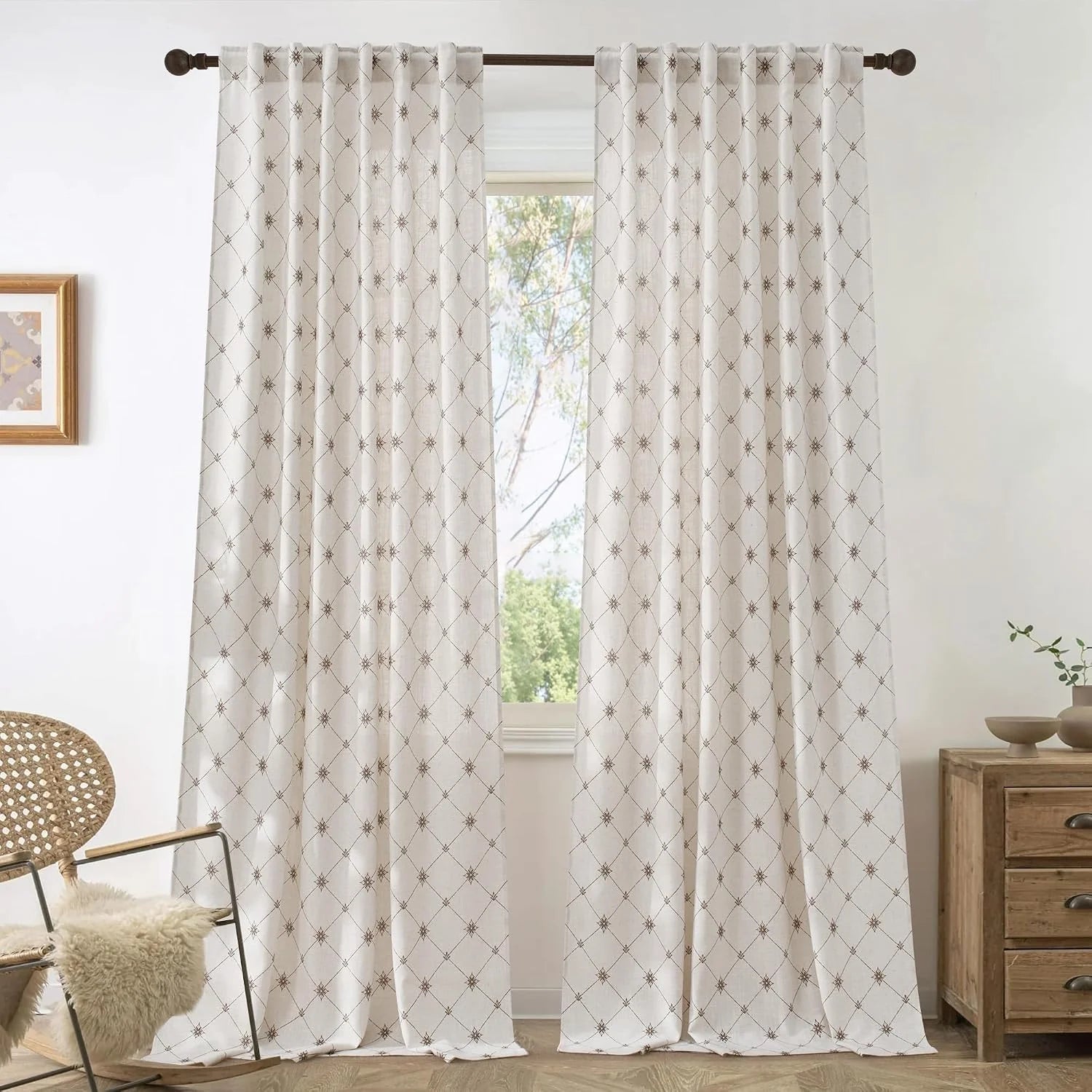 Ivory patterned linen-look curtains on a rod in a bright neutral living room
