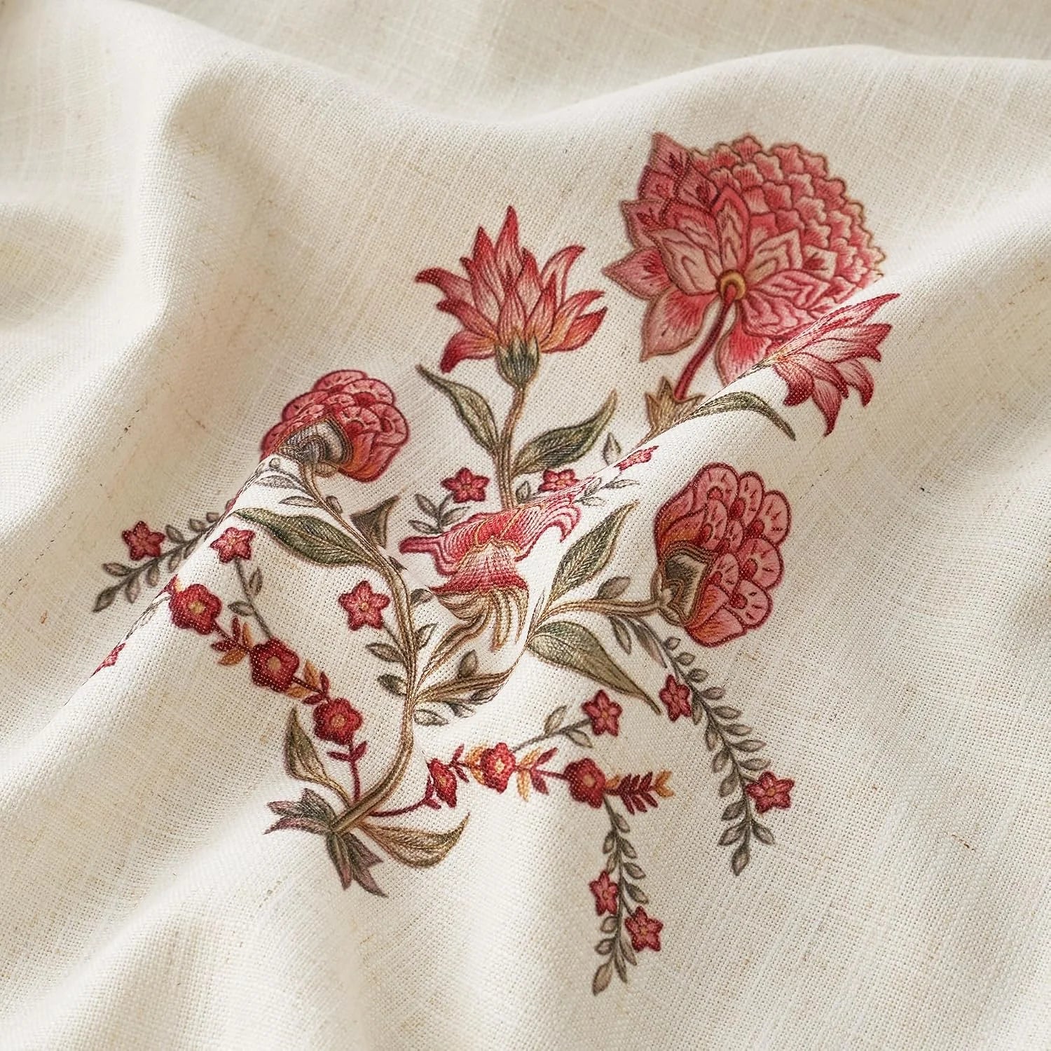 Ivory linen fabric with pink floral embroidery and soft draped texture