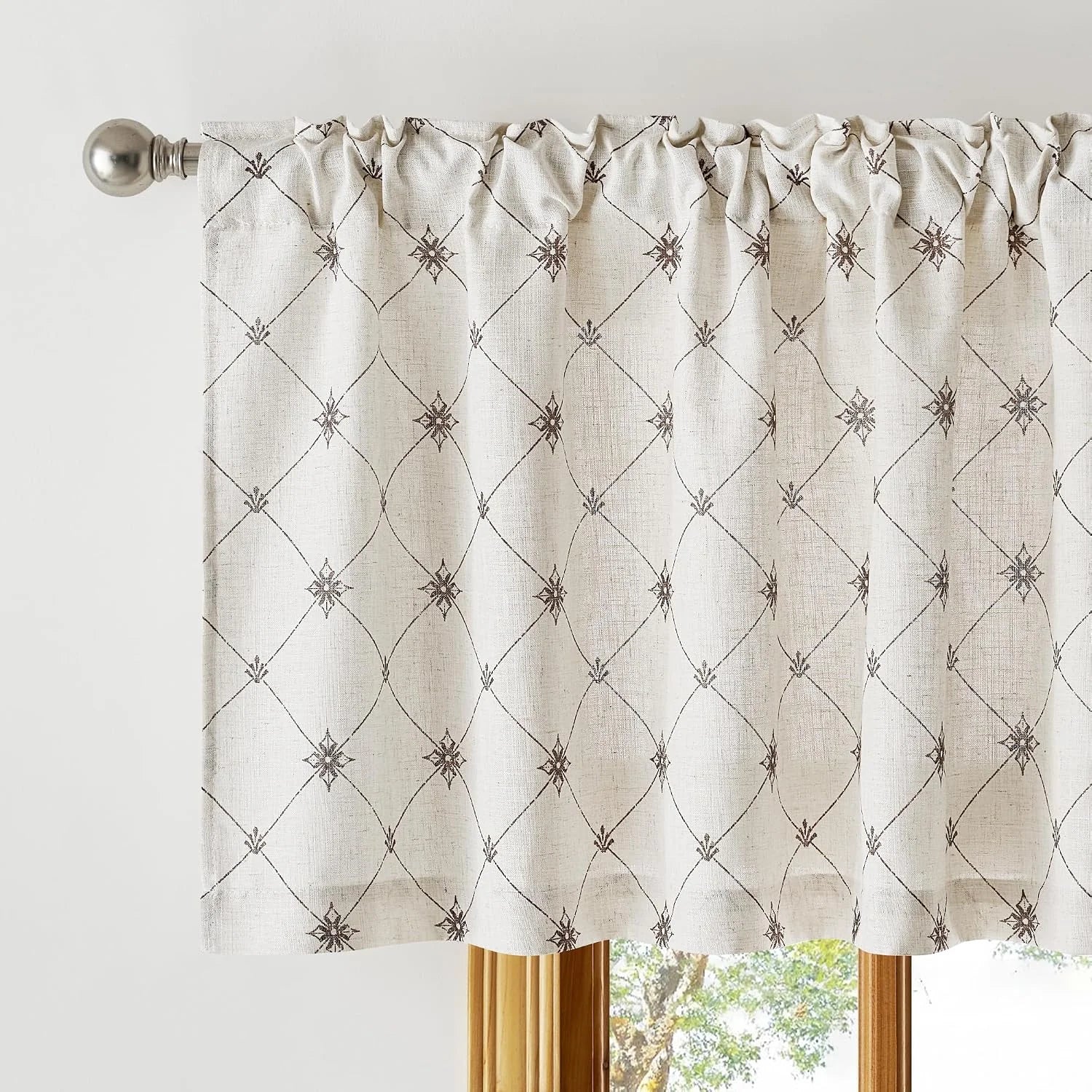 Ivory linen-look window valance with brown geometric pattern on a silver rod
