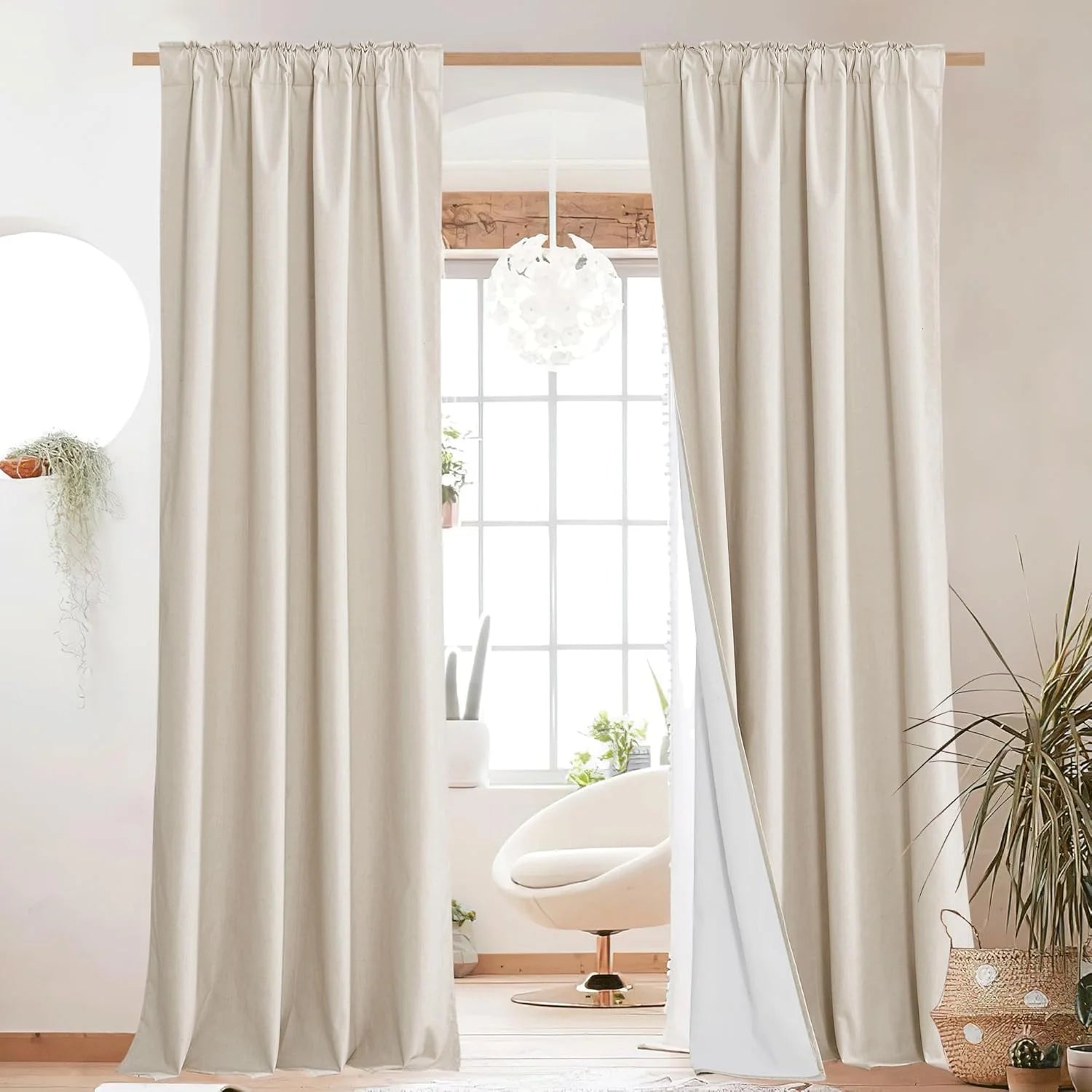 Ivory linen rod pocket curtains framing a bright window in a minimalist room