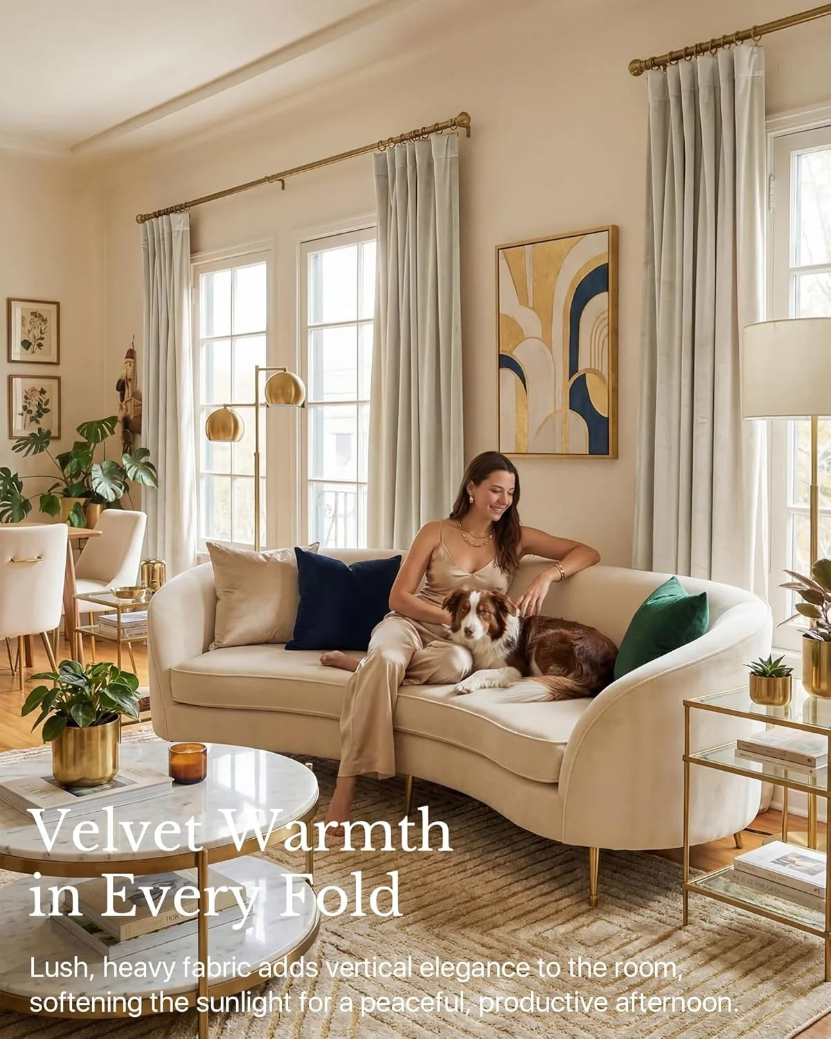 Ivory velvet curtains in a warm glam living room with brass accents, cream sofa, woman and dog