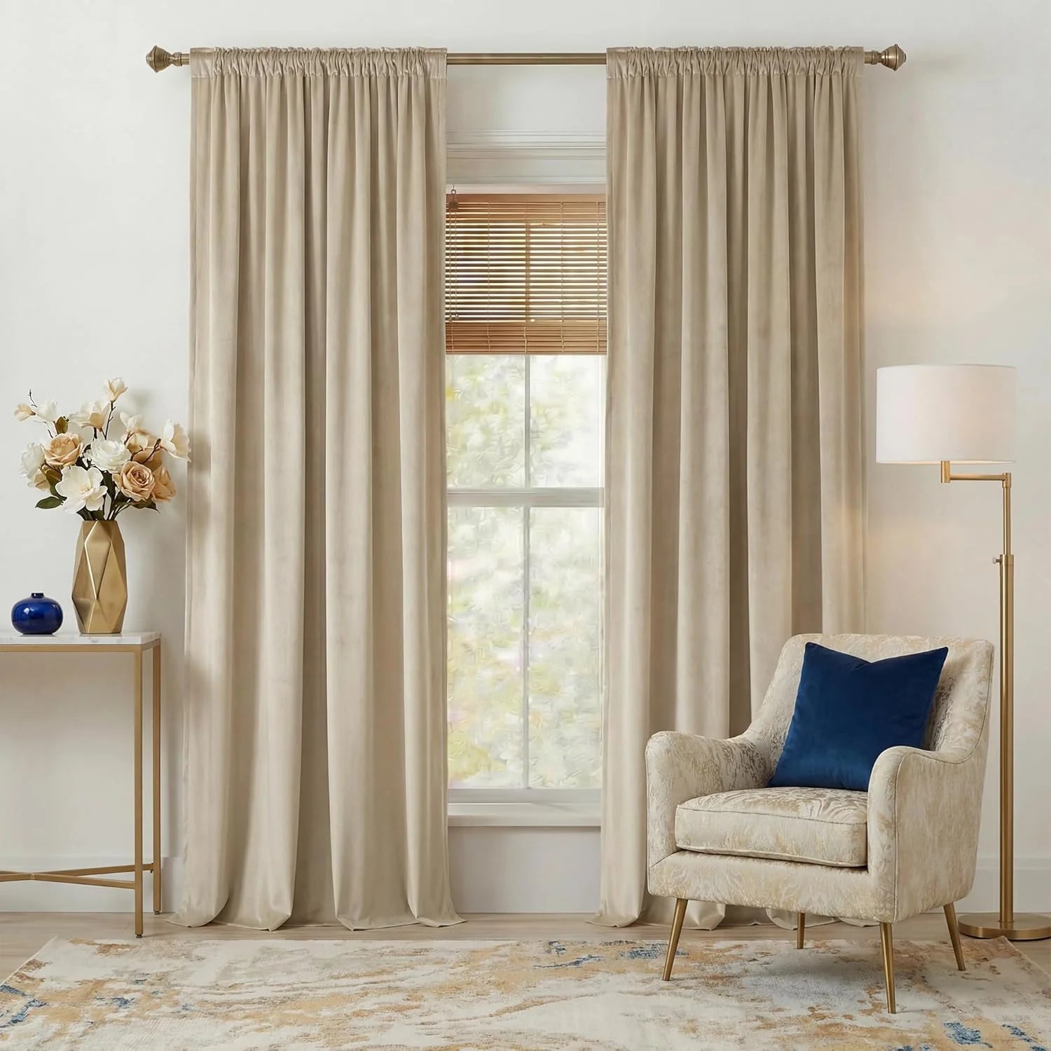 Ivory velvet rod pocket curtains framing a window in a bright modern living room