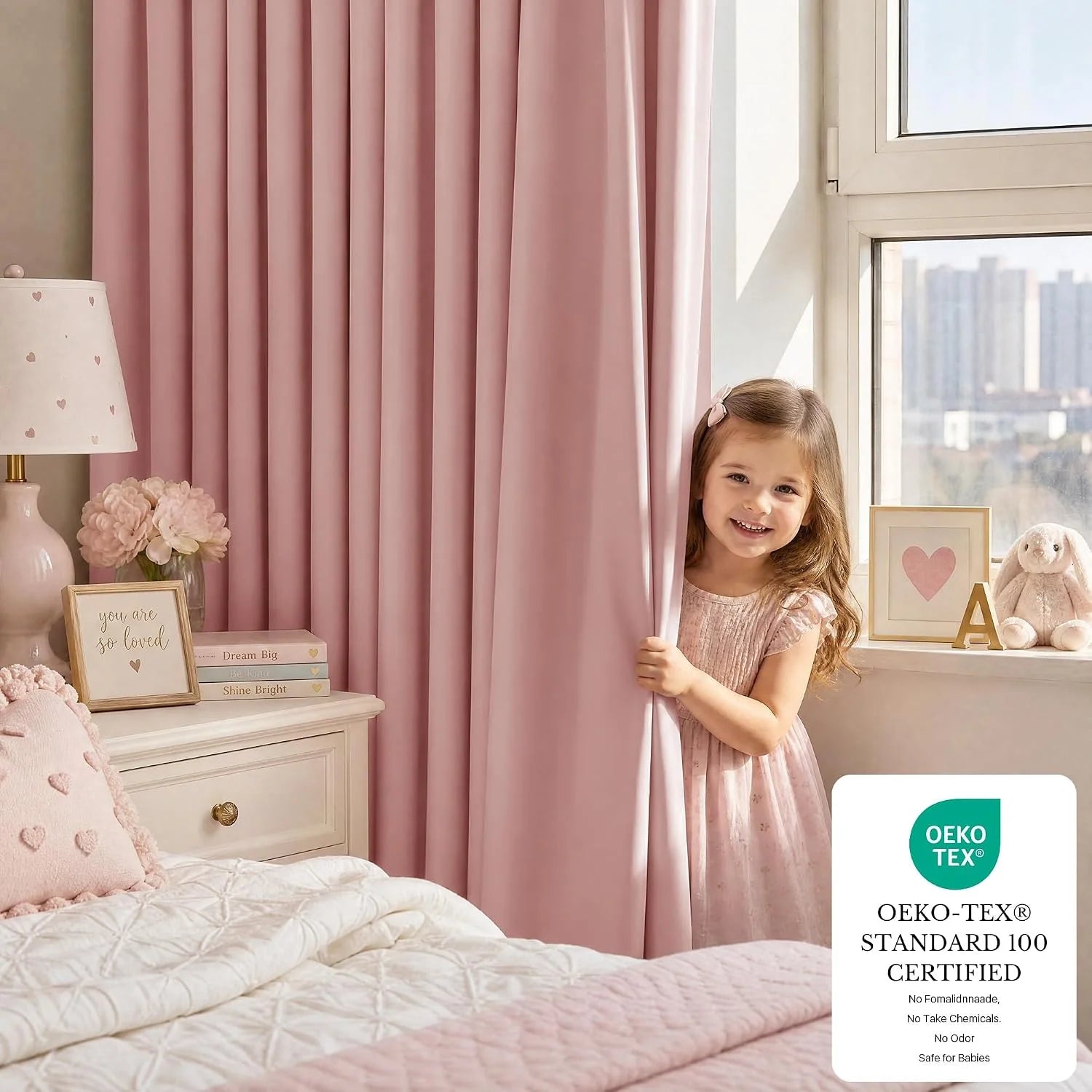 Happy girl peeking from soft pink Oeko-Tex blackout curtains in a cozy kids' bedroom.