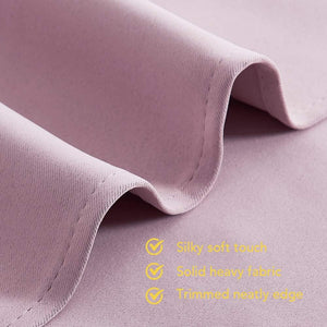 Close-up of a lavender silky soft fabric, showing its heavy texture and neatly trimmed edge.