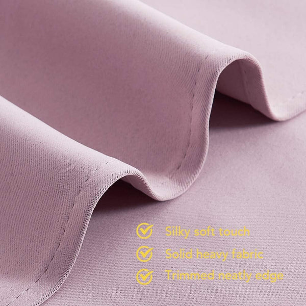 Close-up of a lavender silky soft fabric, showing its heavy texture and neatly trimmed edge.