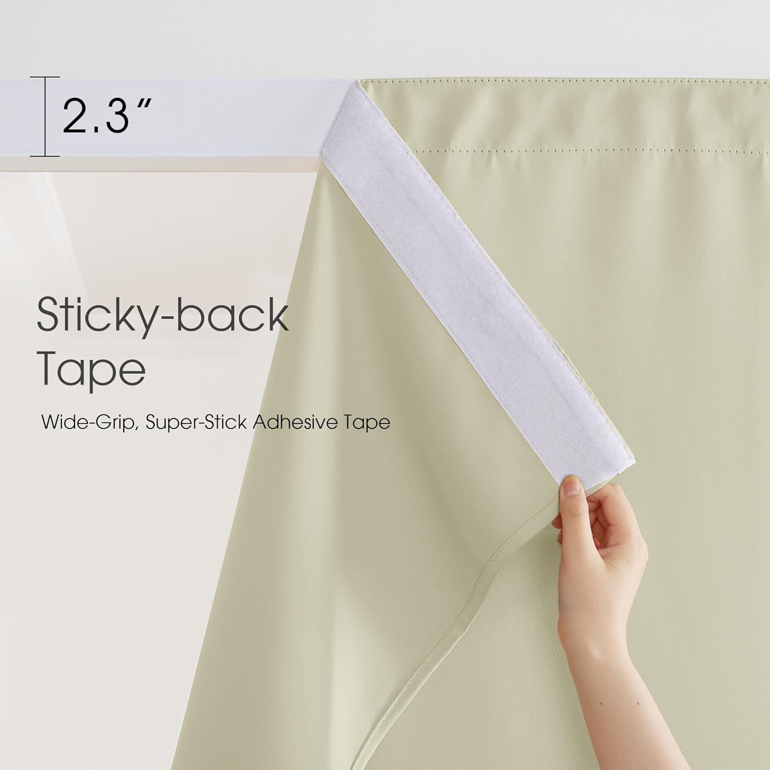 Hand shows 2.3-inch wide white sticky-back tape on light beige blackout curtain fabric.