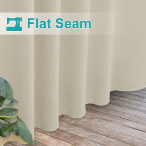 Light beige curtain, smooth fabric, with flat seam and subtle stitched hem above wooden floor.