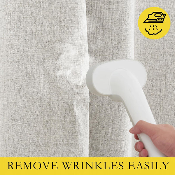 Handheld steamer applies steam to light beige linen-blend curtain, demonstrating easy wrinkle removal.