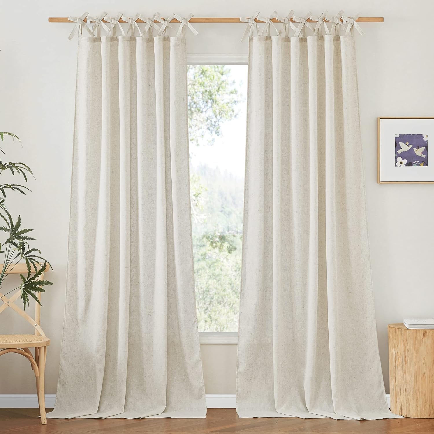 Light beige linen tie-top curtains on a wooden rod in a bright room, showcasing natural texture and relaxed style.