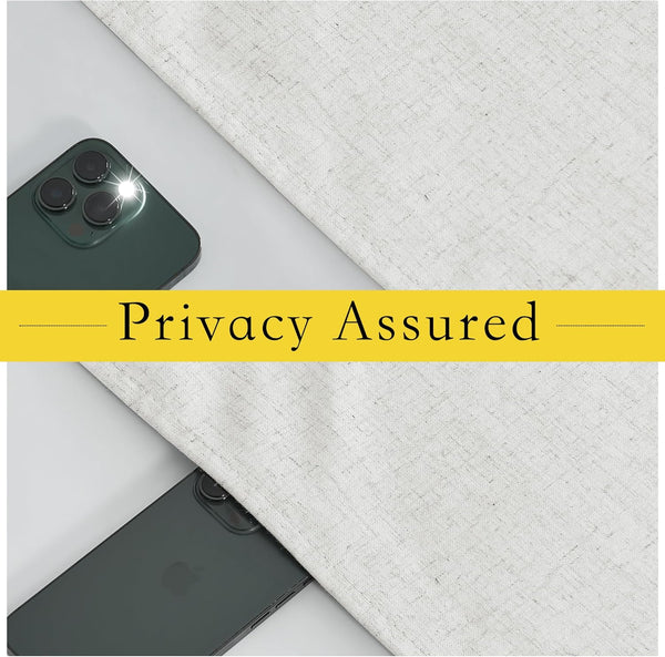 Light beige textured linen curtain fabric demonstrating privacy, with a smartphone flash obscured underneath.