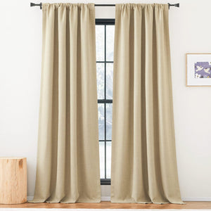 Light beige textured drapes with a rod pocket top, hanging on a black rod over a window.