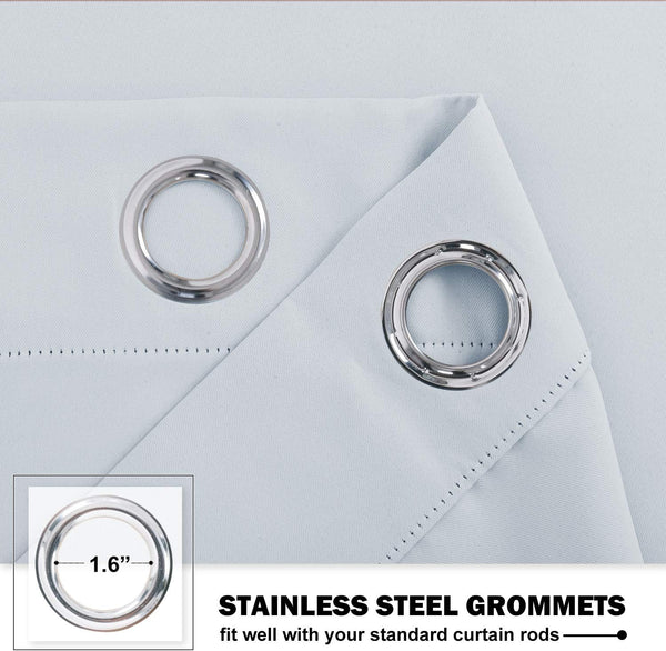 Close-up of light blue curtain fabric showing two prominent 1.6-inch stainless steel grommets.