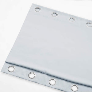 Light blue opaque curtain panel featuring silver grommet rings along the top edge for hanging.