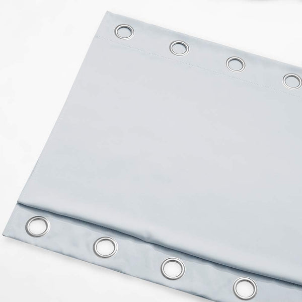 Light blue opaque curtain panel featuring silver grommet rings along the top edge for hanging.