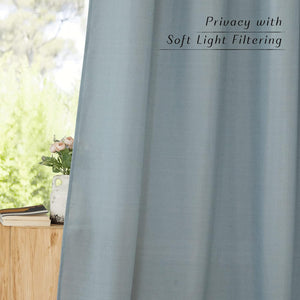 Light blue linen curtain with subtle woven texture, offering privacy and soft light filtering.