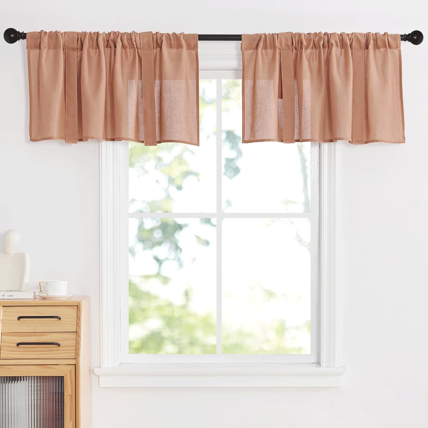 Pair of light brown gathered rod pocket valance curtains made of a slightly sheer linen blend.