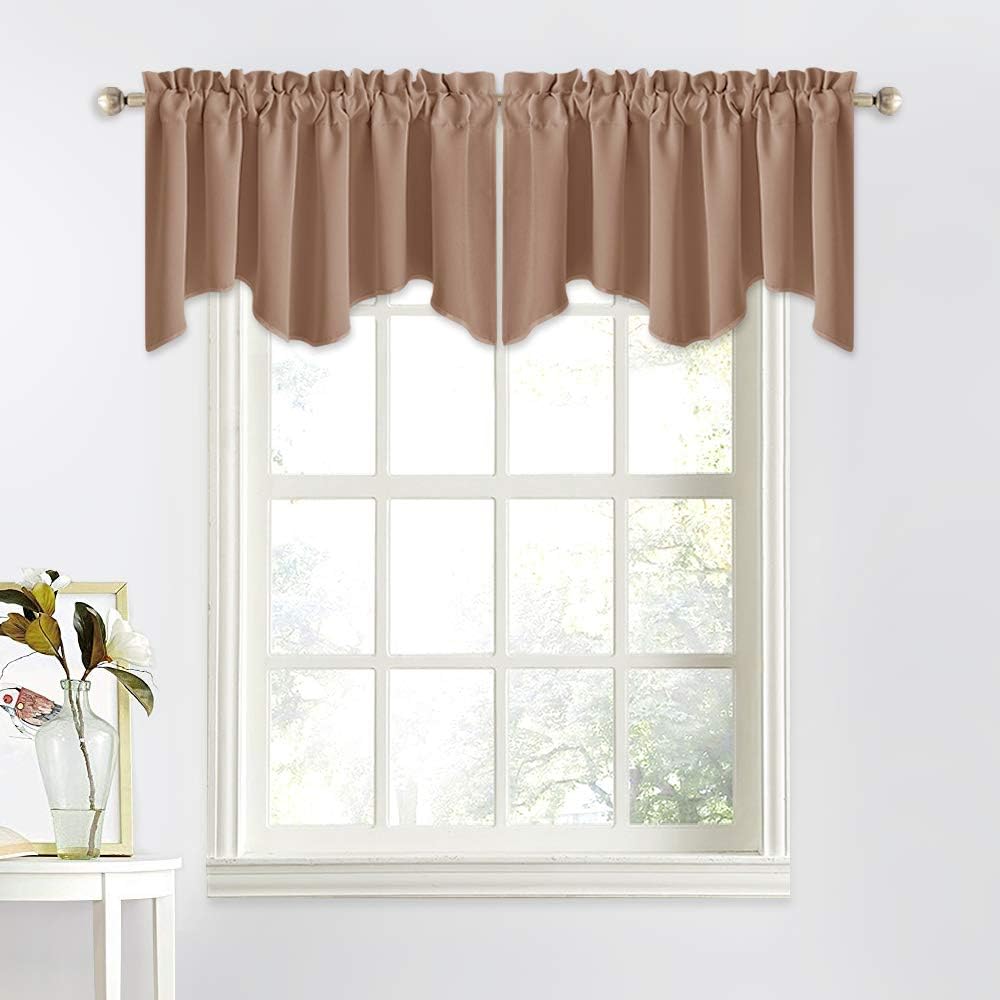 Light brown scalloped valance with ruffled rod pocket top, hung on a white framed window.