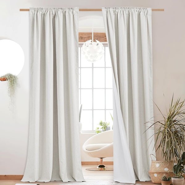 Light gray linen texture curtains with gathered rod pocket top, revealing white blackout lining.