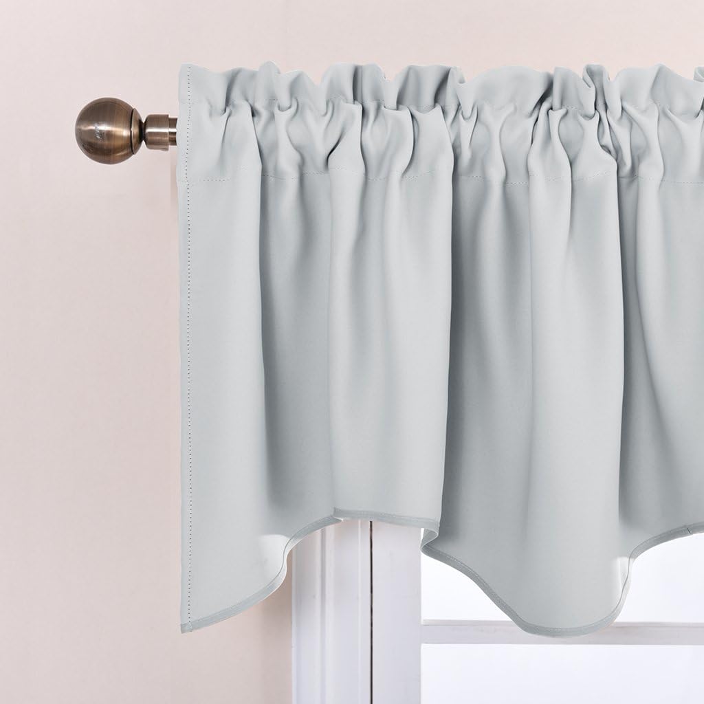 Light gray rod pocket valance featuring a scalloped bottom edge with subtle trim, hanging on a bronze rod.