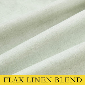 Textured light green flax linen blend fabric displaying its natural weave and subtle, flowing folds.