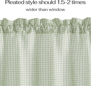 Close-up of a light sage green and white gingham patterned curtain with a ruffled rod pocket top.