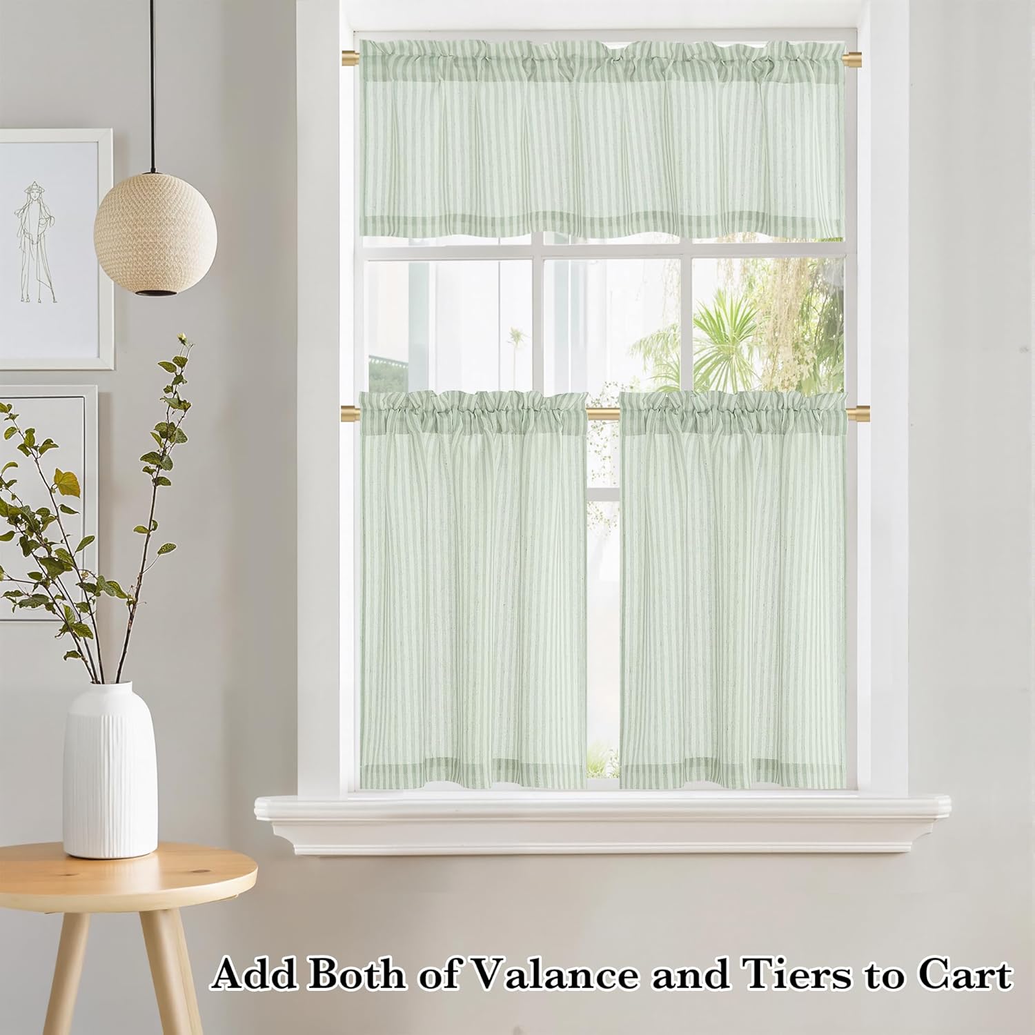 Light green and white striped valance and tier curtains with ruffled tops on a window.