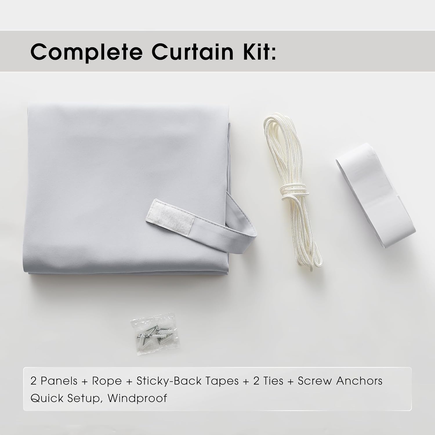 Complete light grey curtain kit with a folded panel, white rope, sticky tape, screws, and anchors for quick setup.