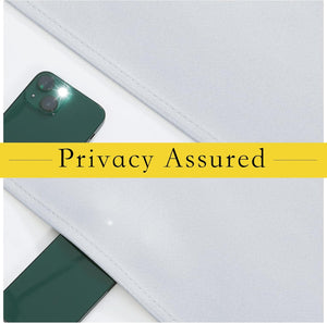 Close-up of light grey fabric showcasing complete privacy by blocking a smartphone's flash.
