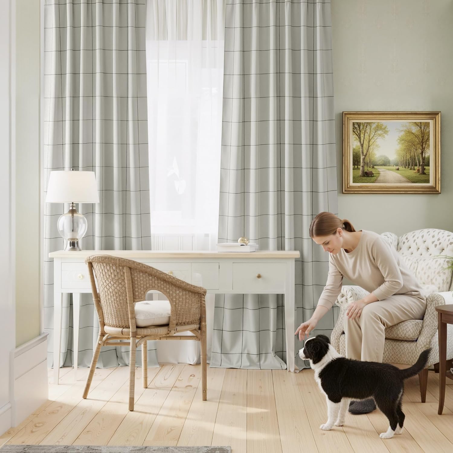 Light grey curtains with a thin black grid pattern hanging on a window in a cozy room, next to sheer white panels.