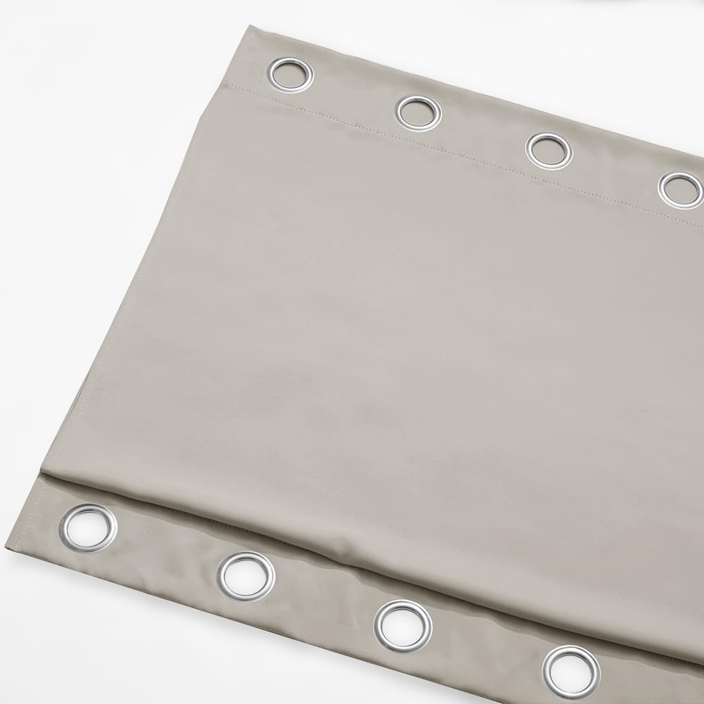 Light grey curtain panel with silver grommet rings visible along the top. Smooth, substantial fabric.
