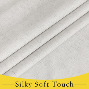 Close-up of a light grey, linen-look drapery fabric with a soft, subtle woven texture and gentle drape.