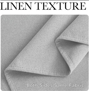 Close-up of light grey linen texture fabric, folded to show its uniform weave and finished edges.