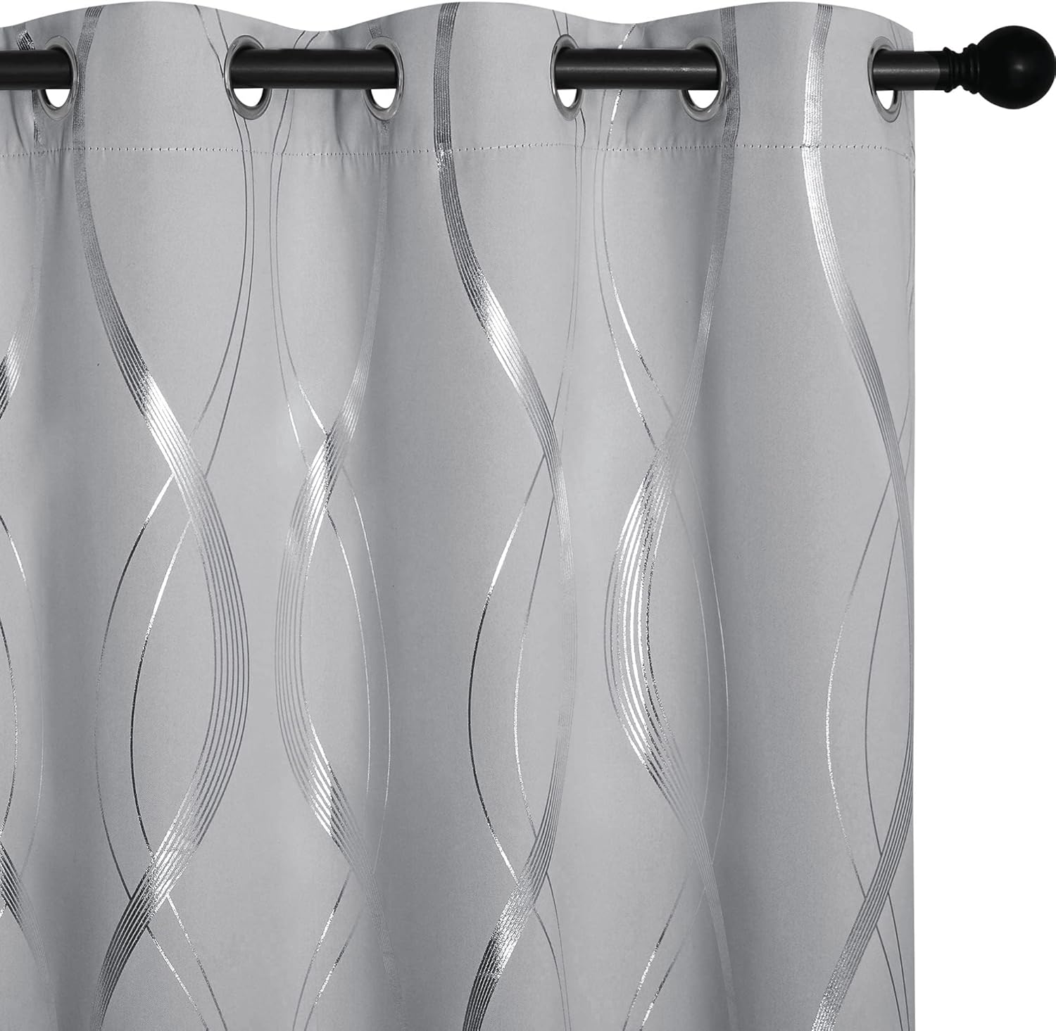 Light grey curtain panel with silver metallic wavy geometric pattern and grommet top, hanging on a dark rod.