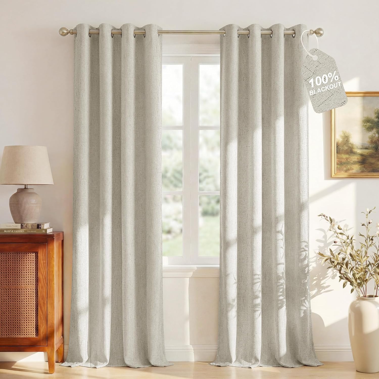 Light grey textured blackout curtains with grommet top visible, labeled '100% Blackout' in a room.