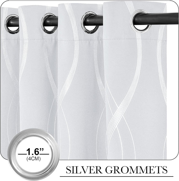 Light grey curtains with subtle wavy white lines and prominent silver grommets on top.