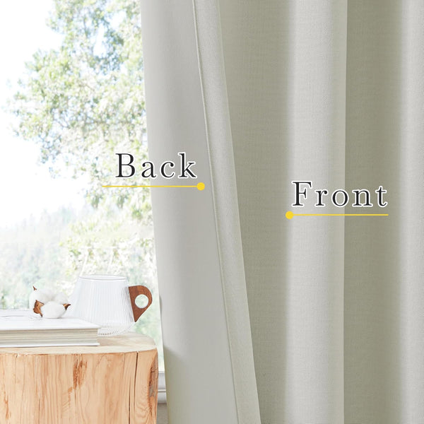 Light grey woven textured room darkening curtains hanging, showing the distinct front and back.