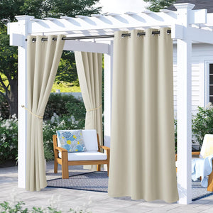 Light khaki grommet outdoor curtains hang from a white pergola, tied back to shade a patio seating area.