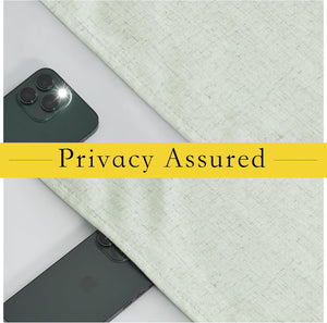 Light linen-textured fabric covering smartphones, one with a bright flash, demonstrating assured privacy and blackout.