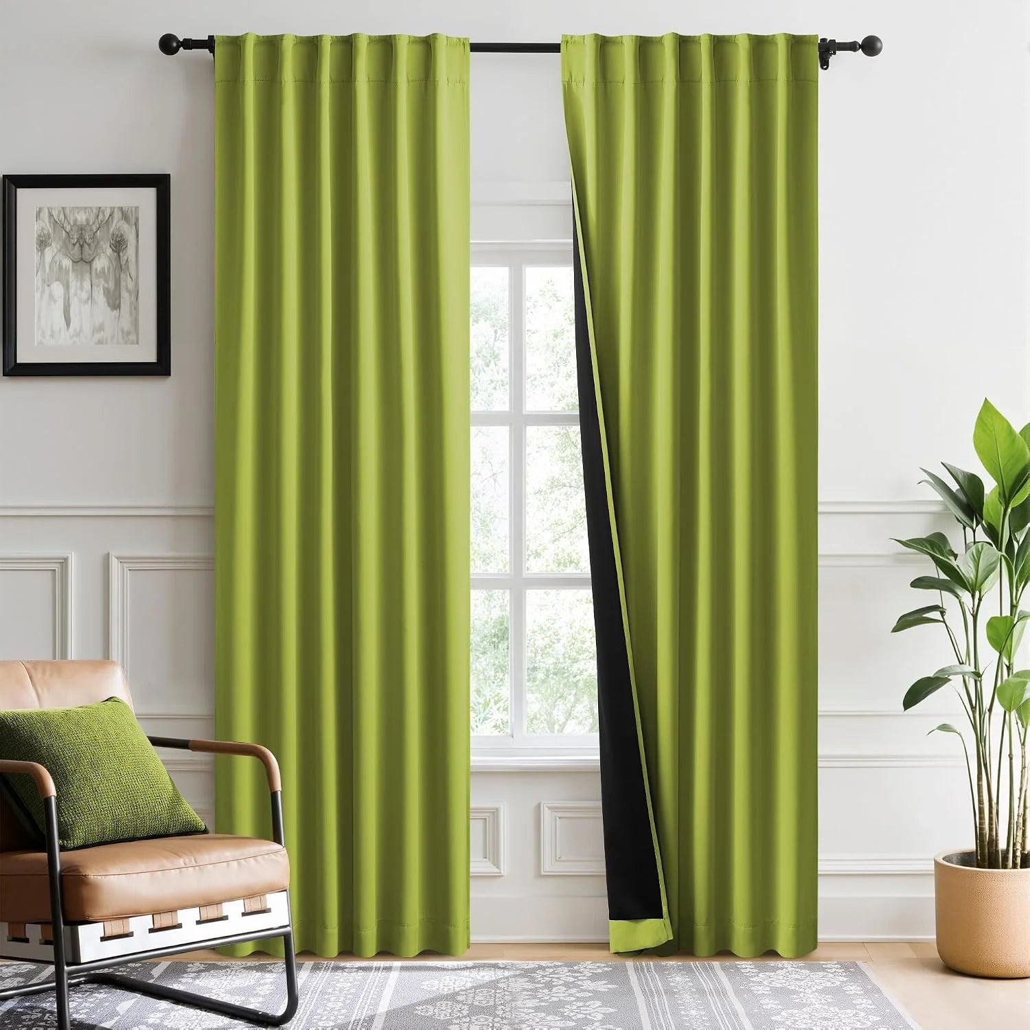 Lime green blackout curtains with black lining on a rod in a bright modern living room