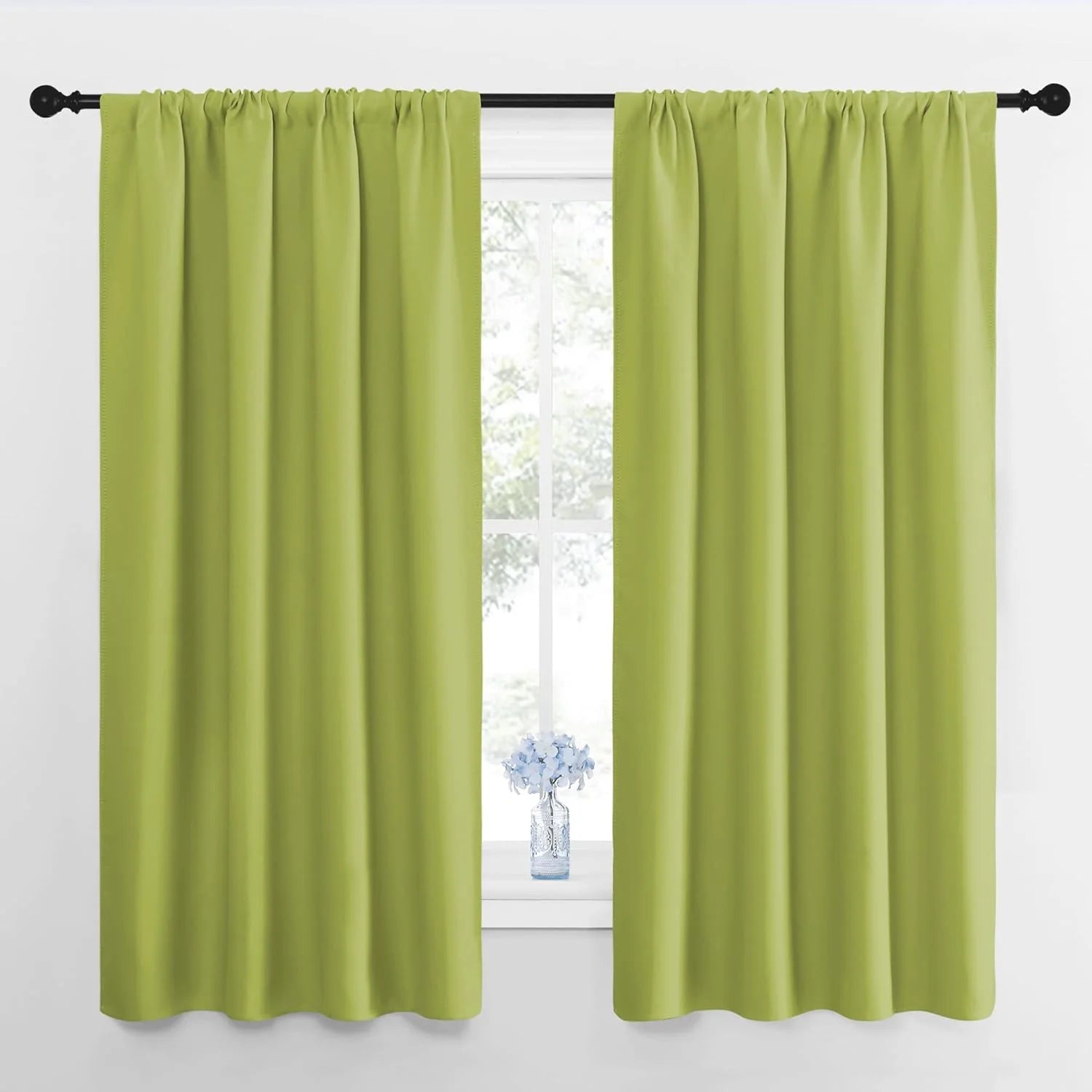 Pair of vibrant lime green solid room darkening curtains with rod pocket top